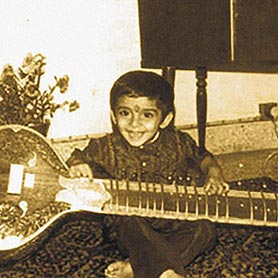 Age 4, with my Father’s Sitar